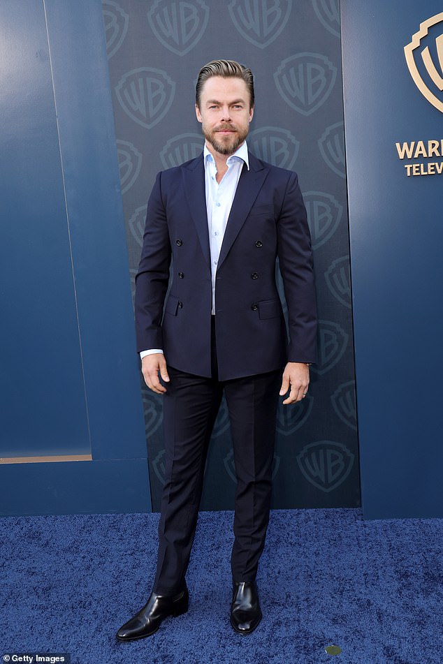 Dancing with the Stars pro Derek Hough, 40, cut a handsome figure in a crisp navy suit
