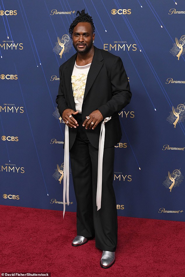 Chewing Gum and Slow Horses actor Kadiff Kirwan looked suave in an oversized black suit jacket featuring white ribbons