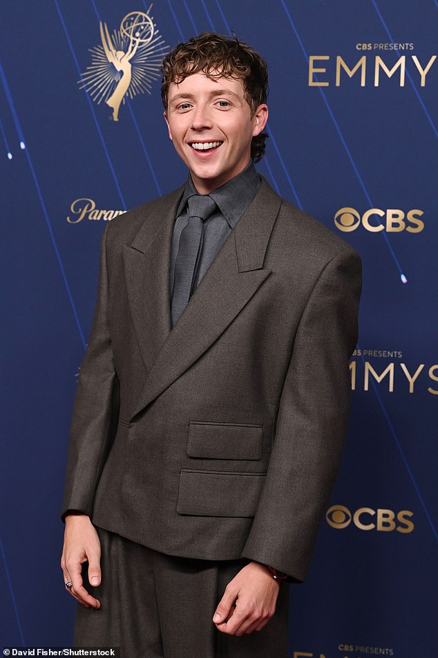 The actor from Barry opted for a chic oversized dark brown suit, paired with a dark grey shirt and a tie
