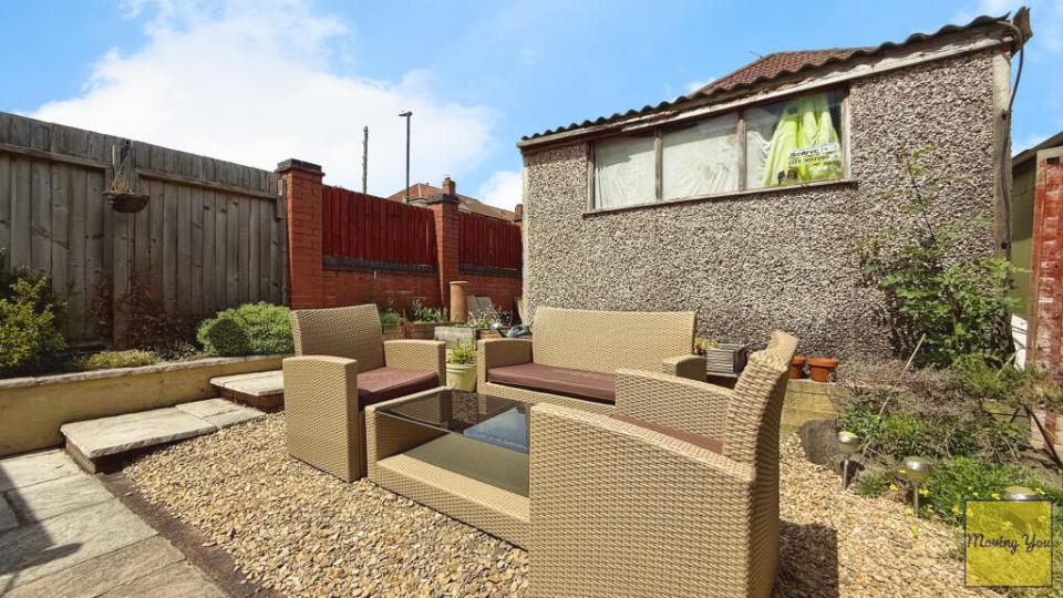 Back garden with patio furniture.