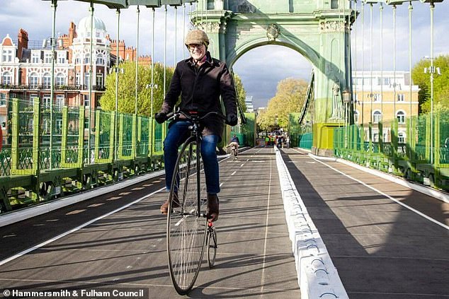 Bikes and pedestrians are able to use the bridge. (Pictured: Jeremy Vine on a penny farthing using the new carriageway)