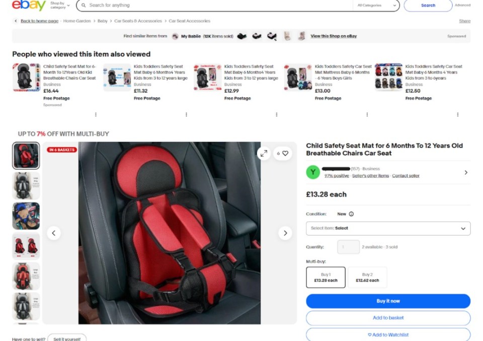 Red and black child car seat safety booster cushion.