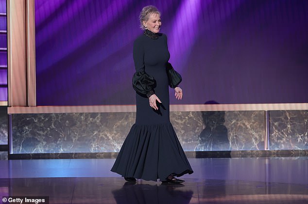 She hobbled to the podium to accept the honor and revealed why during her acceptance speech as she said: 'If I was walking like John Wayne, it's because I broke my knee this summer and it's not quite repaired'