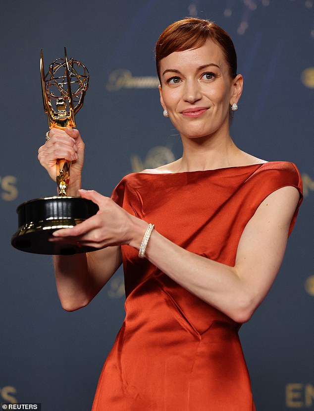 Britt proudly held up her shiny new trophy in the press room