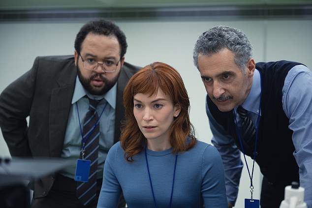 When a mysterious colleague appears outside of work, it begins a journey to discover the truth about their jobs (seen left to right: Zach Cherry, Britt Lower, and John Turturro)