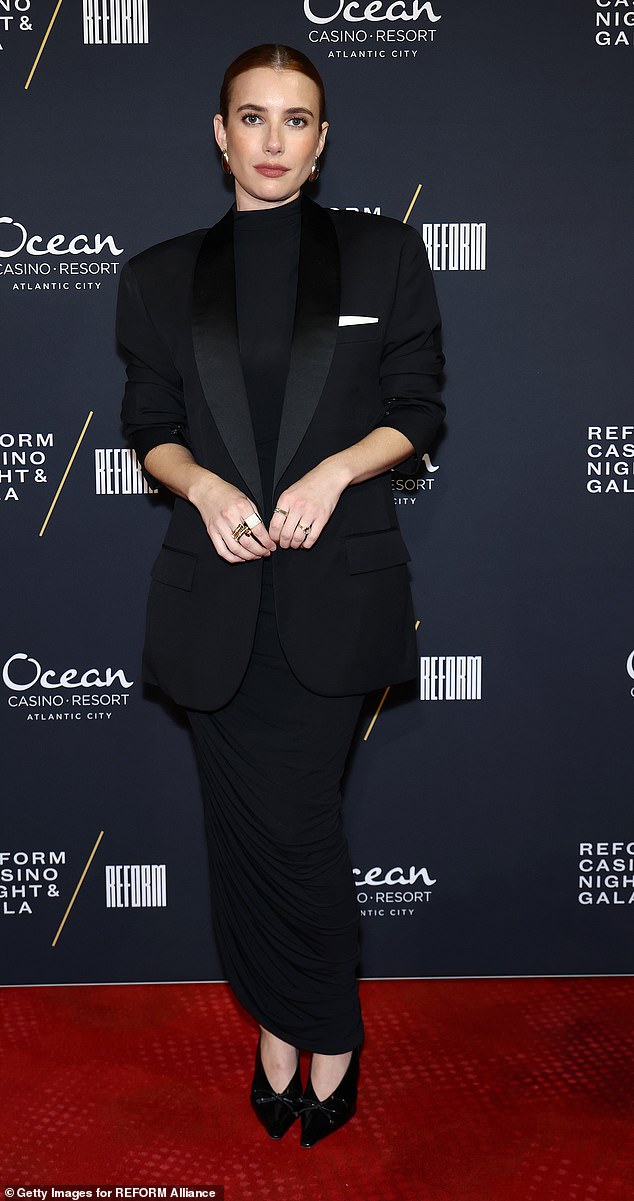 Roberts, 34, wore a ruched black turtleneck gown with a tuxedo jacket and a black turtleneck top. Her reddish-brown locks were pulled back in a sleek bun