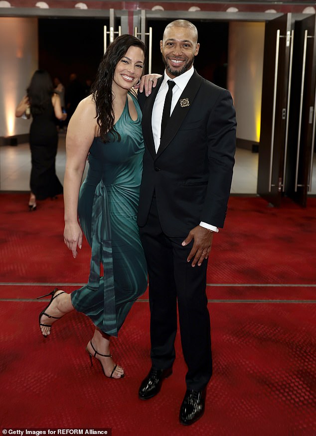 Graham's plus one for the evening was her husband, Justin Ervin, 36, who looked dapper in a black tuxedo with a button down shirt and tie. He accessorized with what appeared to be an antique brooch on his lapel