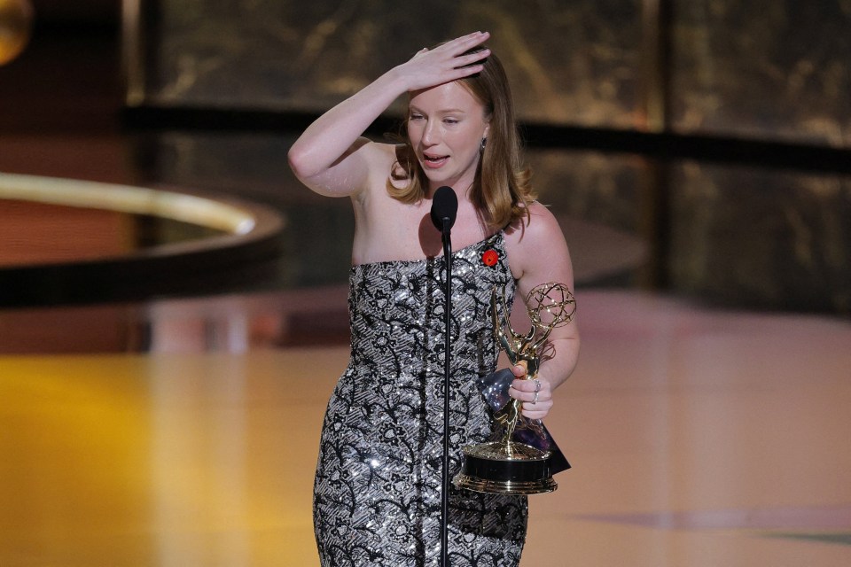 Hannah Einbinder accepting an Emmy award.