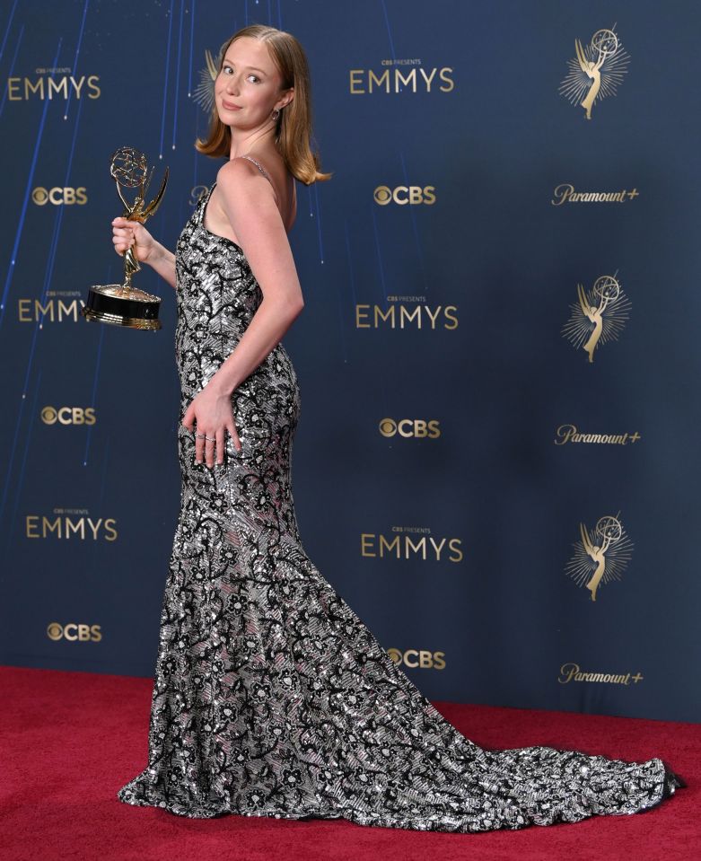 Hannah Einbinder holding her Emmy Award for Outstanding Supporting Actress in a Comedy Series.
