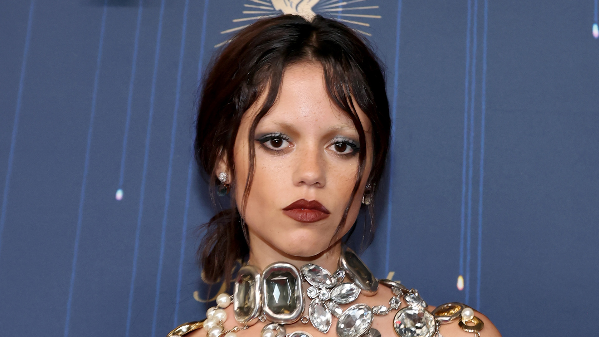 Jenna Ortega goes topless under just sparkling Givenchy jewel necklace on the Emmys red carpet