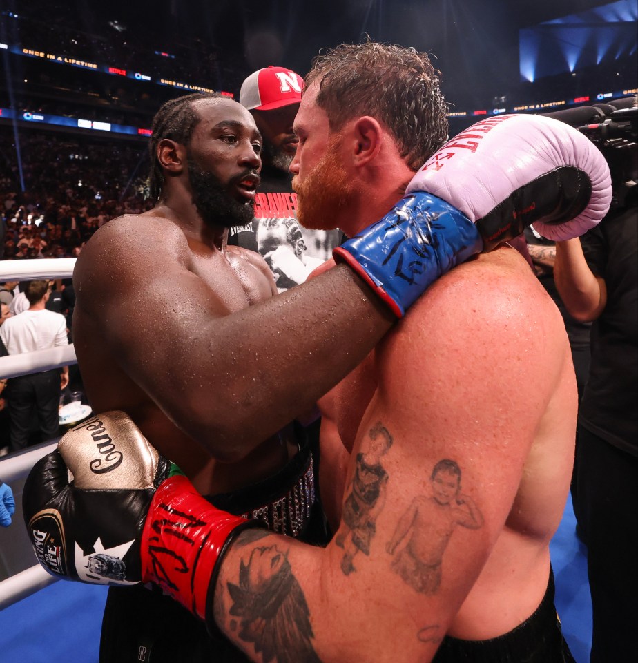 Terence Crawford and Canelo Alvarez after a boxing match.