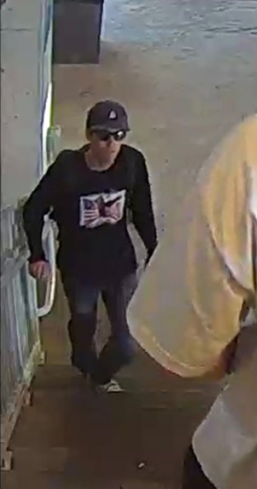 Surveillance image of Tyler Robinson, person of interest in a shooting.