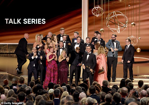 The audience rose to give Colbert a standing ovation as he accepted the award