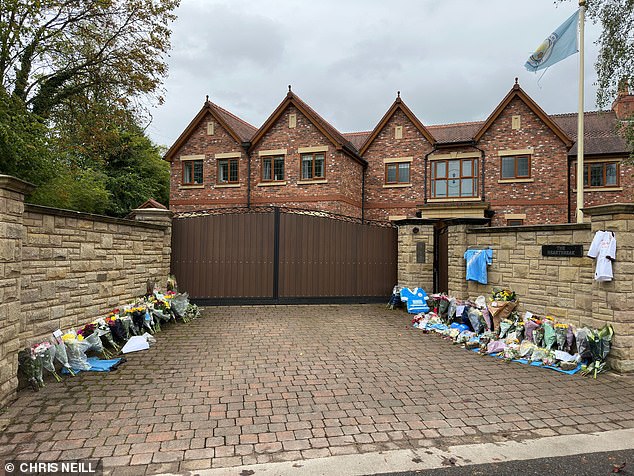 Flowers outside the Hitman's home where he was found dead yesterday