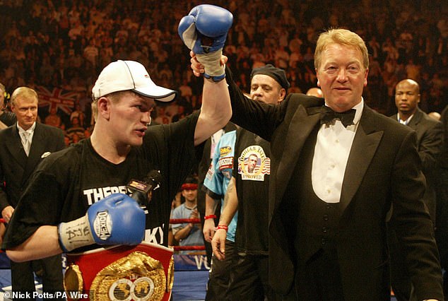 Ricky Hatton has his arm lifted by promoter Frank Warren as they celebrate victory over Kostya Tszyu