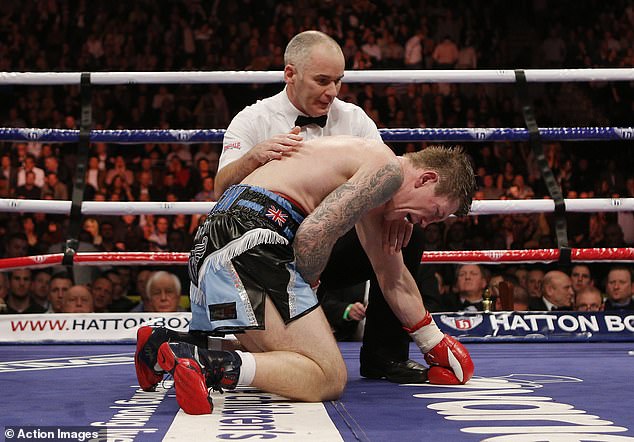 Ricky Hatton is consoled by referee Victor Loughlin in a comeback fight against Vyacheslav Senchenko