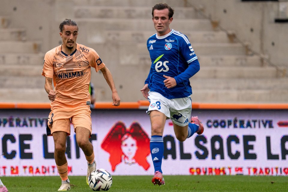 Soccer players vying for the ball.