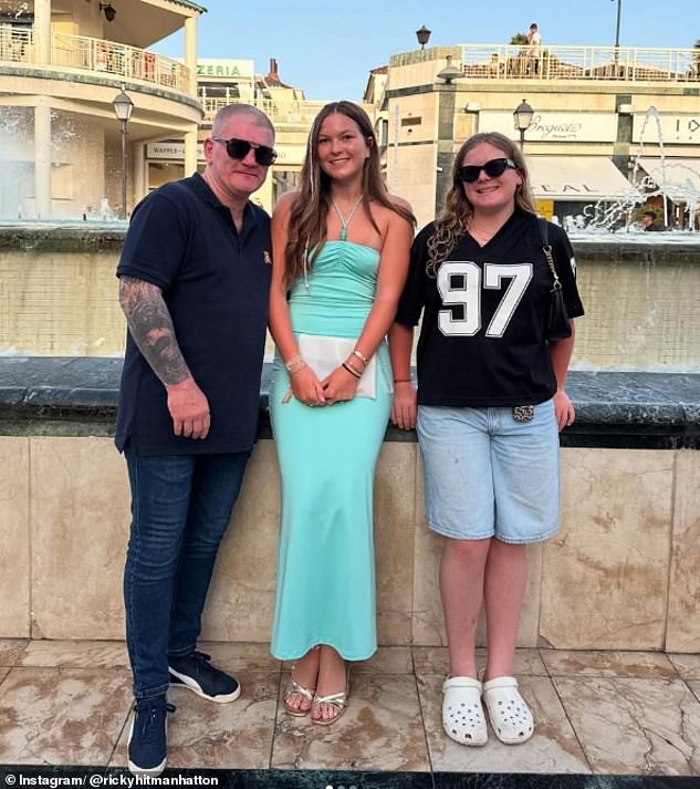 The boxer shared a photograph with his daughters, Millie and Fearne, while on holiday in Tenerife this summer (pictured)