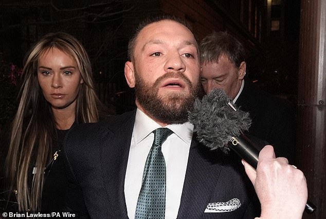 Mixed martial arts fighter Conor McGregor and partner Dee Devlin leave the High Court in Dublin on November 22, 2024