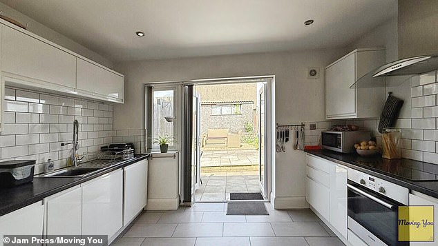 The listing on Moving You reads: 'This well-presented, extended 1930s three-bedroom terraced home offers a perfect blend of period character and modern living, complete with a garage, a kitchen extension, and a private enclosed rear garden'