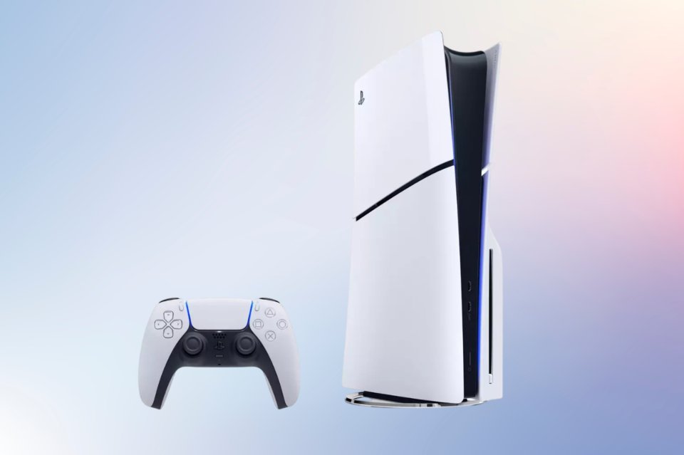 a white playstation with a controller next to it