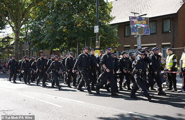 An army of black-clad police officers lined the streets for Notting Hill Carnival after the festival had recently been linked with violence and disorder