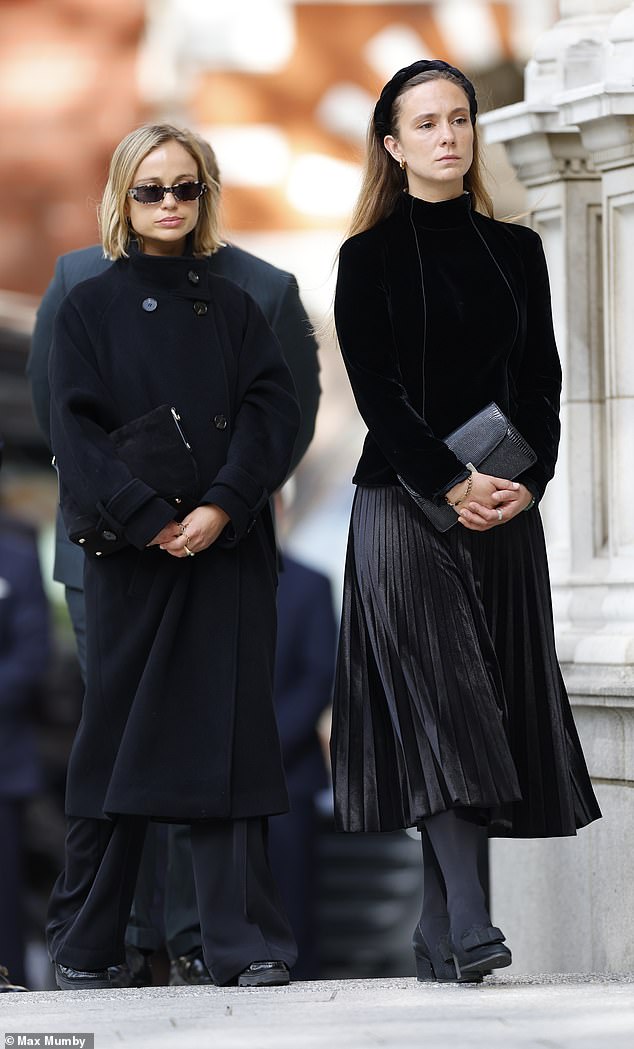 Lady Marina Charlotte Windsor (right) and Lady Amelia Windsor look sombre as they arrive at Westminster Cathedral ahead of their grandmother's funeral tomorrow