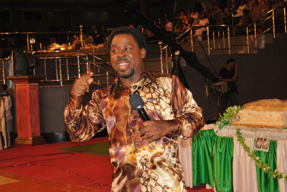 T. B. Joshua, a Nigerian charismatic pastor, televangelist, and philanthropist, speaking into a microphone.