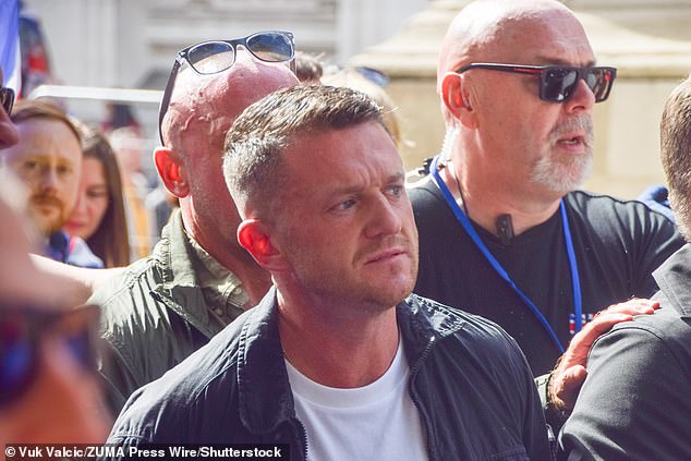 Tommy Robinson takes part in the 'Unite The Kingdom' march in Westminster on Saturday