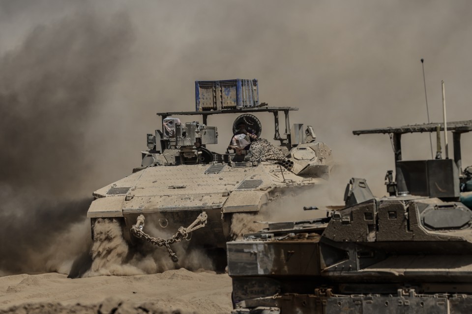 Tanks and armored vehicles belonging to the Israeli army are seen mobilizing near the Gaza border.