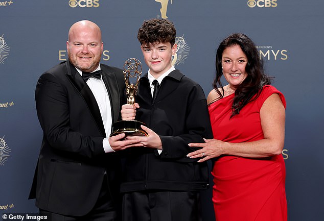 Owen is pictured here with his father, Andy, and mother, Noreen, in the press room at the Peacock Theatre -- September 14, 2025