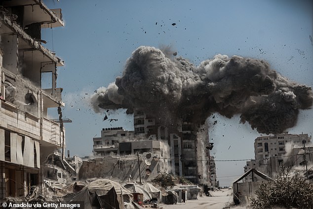 Smoke rises following Israeli airstrikes that hit and destroyed multiple buildings and high-rise towers in Gaza City, Gaza on September 14