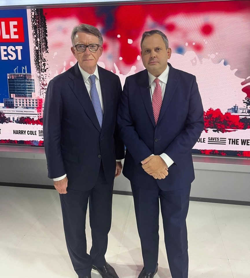 Two men in suits standing together.