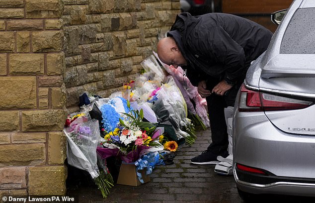 Speak lays flowers outside the boxing legend's home following his death