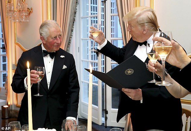 President Donald Trump and Britain's Prince Charles toast, during the Return Dinner in Winfield House, the residence of the Ambassador of the United States of America in Regents Park