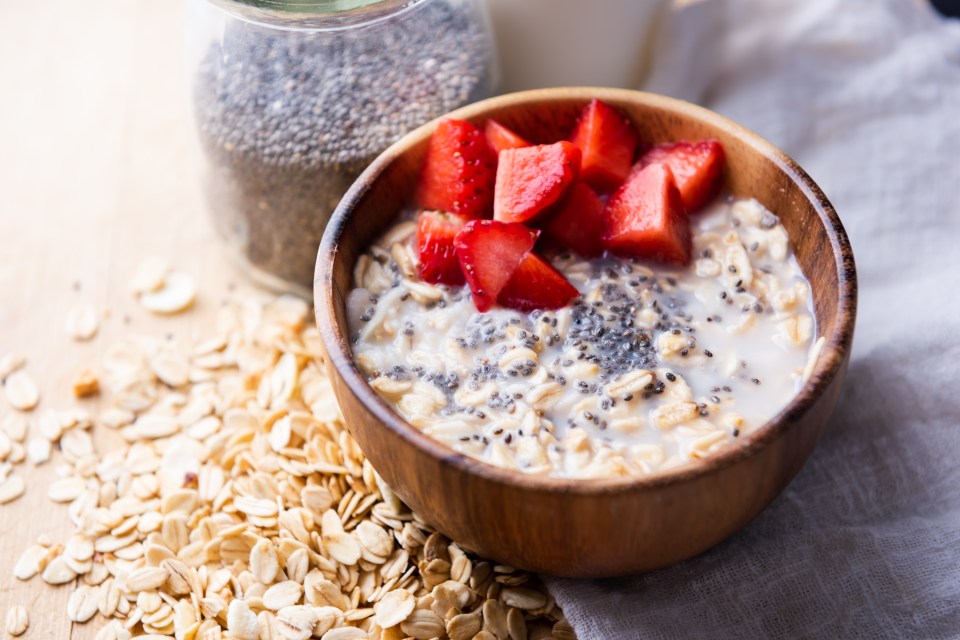 Oatmeal porridge with chia seeds and strawberries.