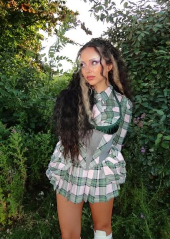 Jade Thirlwall wearing a green and pink tartan outfit.