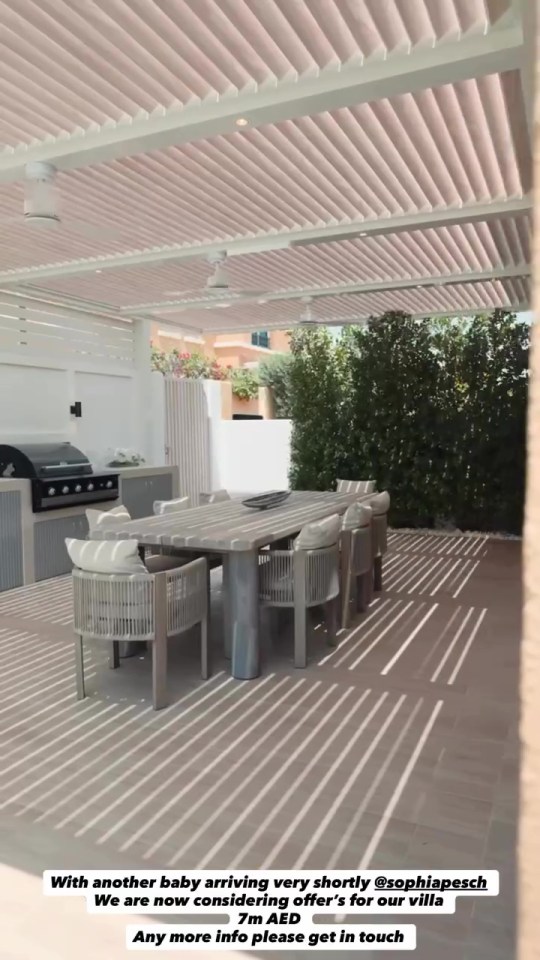 Sophia Peschisolido's Dubai villa for sale, featuring an outdoor dining area with a long table, chairs, and a BBQ.