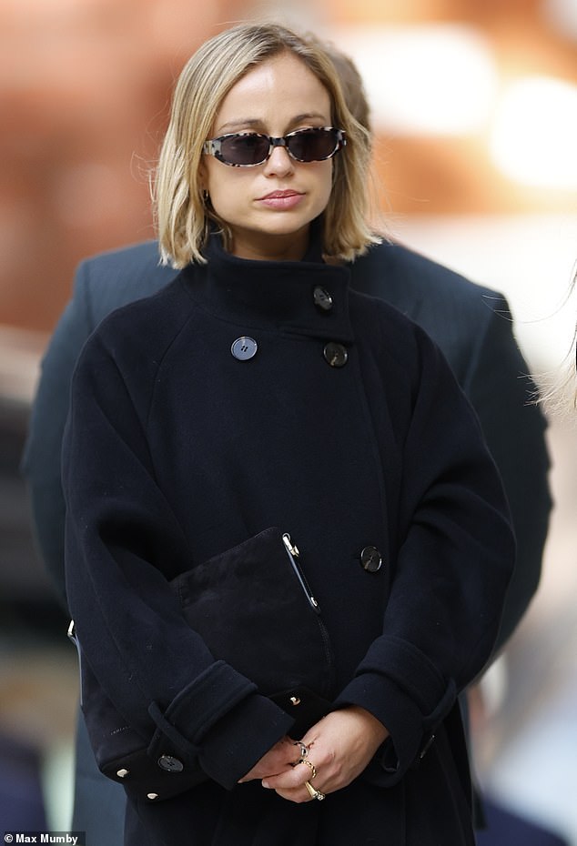Lady Amelia Windsor (pictured) looked sombre as she arrived at Westminster Cathedral yesterday - ahead of her grandmother's funeral