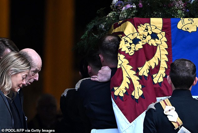 The Duke of Kent looks on while Lady Helen Taylor bows her head as the Duchess of Kent's coffin is carried into Westminster Cathedral
