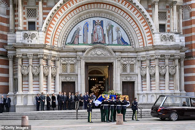 Pictured: The bearer party carry the coffin of Katharine, Duchess of Kent into Westminster Cathedral ahead of her funeral