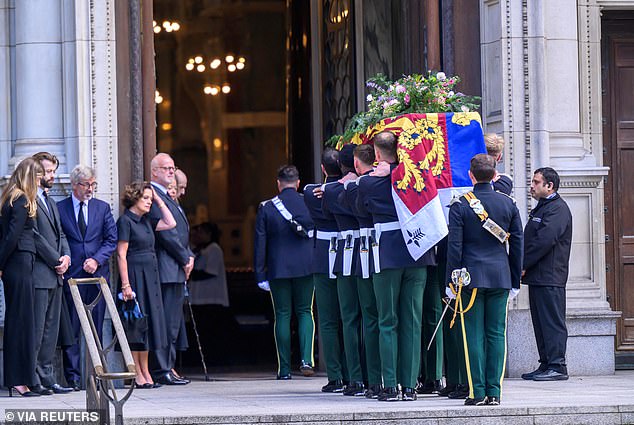 The coffin of the Duchess of Kent is carried for a private vigil on the eve of the Requiem Mass to be held for her in Westminster Cathedral