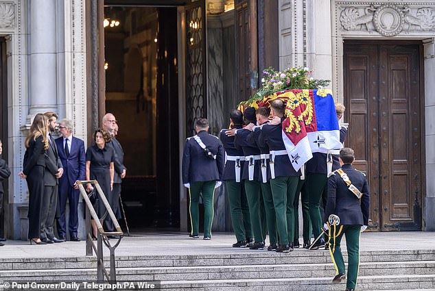 Family members watch on as the coffin of the Duchess of Kent arrives at Westminster Cathedral