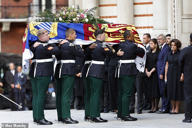 The Duchess of Kent's coffin, borne by soldiers of The Royal Dragoon Guards of which the duchess was Deputy Colonel-in-Chief, arrives at Westminster Cathedral