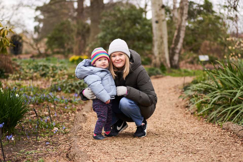 Rosie Bridge, diagnosed with Batten disease, and an adult woman wearing winter clothing.