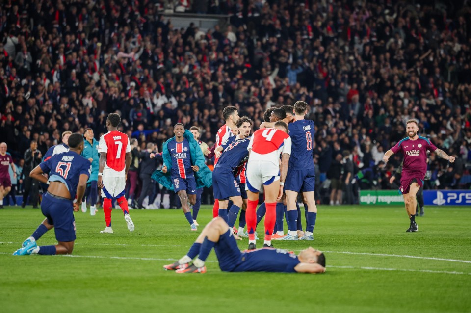 PSG players celebrate as Arsenal players appear dejected after the Champions League semi-final.
