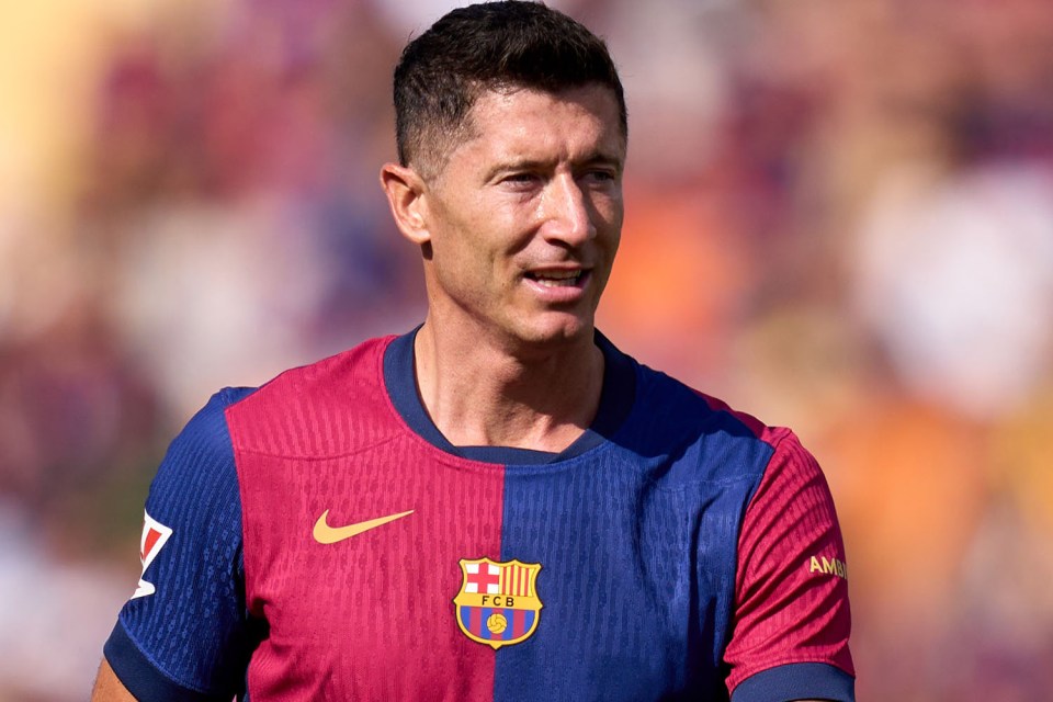 Robert Lewandowski in a split red and blue FC Barcelona jersey.