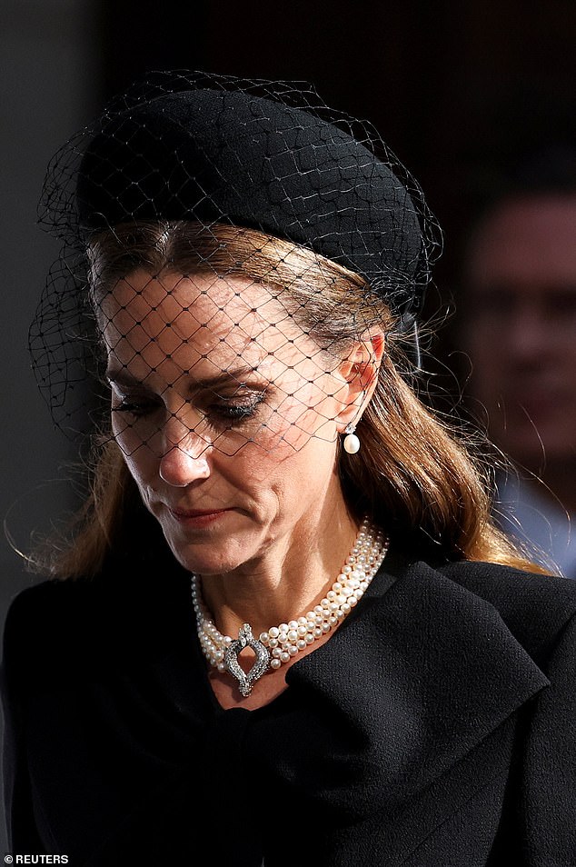 Kate looked deep in thought during the sad occasion