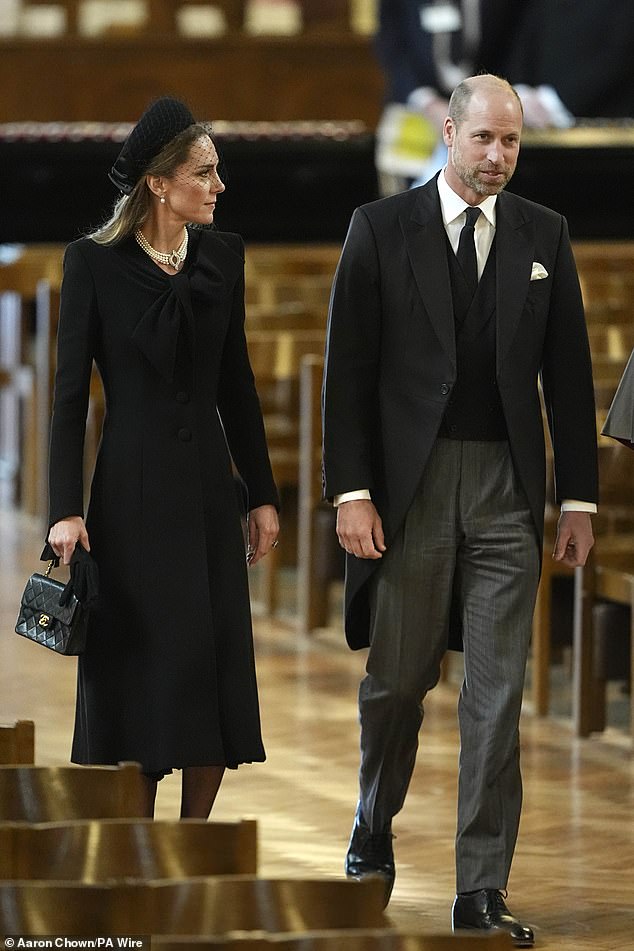 The couple, all sporting black, made an appearance for the Requiem Mass service together this afternoon