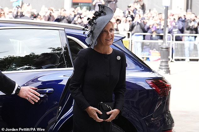 Sophie also carried a matching black handbag as she stepped out of the car